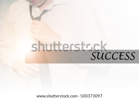 Hand writing SUCCESS with the young business man on background. Business concept. Stock Photo.