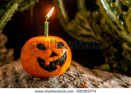 Halloween fruit on dirty background