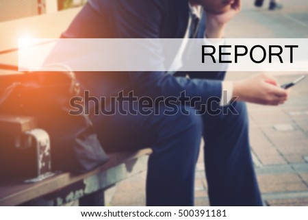 Hand writing REPORT with the young business man on background. Business concept. Stock Photo.