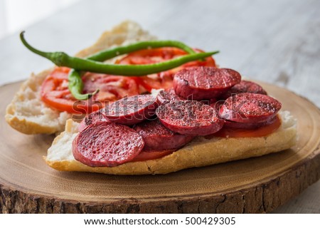 Sucuk Ekmek / Sausage in Bread
 Royalty-Free Stock Photo #500429305