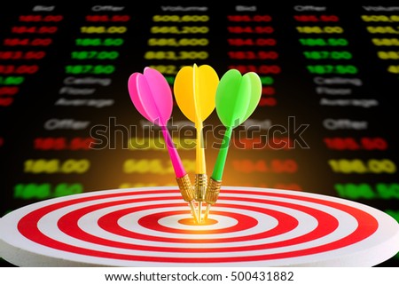 Dart hitting in target center of dartboard with stock chart market background,competitive business concept,organization that has potential to be lead the business.