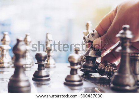 The man play chess game on the chess board the concept image of business