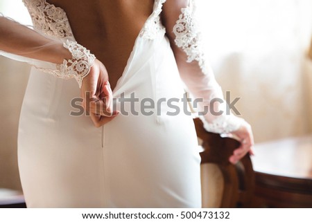 yong bride wears her wedding white  dress