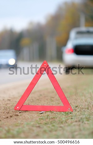 The image of an emergency sign on a road
