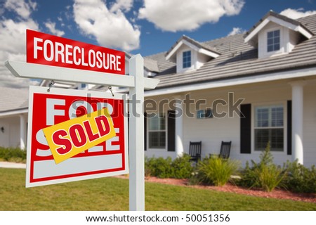 Sold Foreclosure Home For Sale Real Estate Sign in Front of New House - Left Facing.
