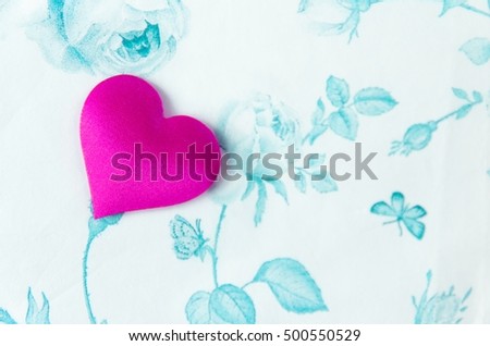 Beautiful pink love heart on a delicate paper flower background, background for greeting cards, wedding, gift, place for text, closeup