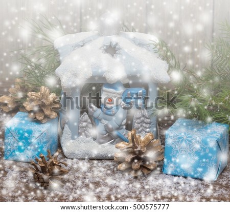 Winter. Christmas Gifts . Wooden Background with Drawn Snowfall. Toned.