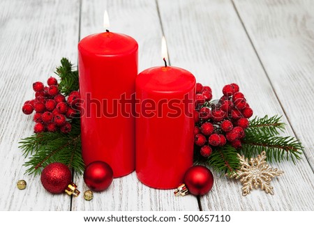 decorative christmas composition with red candles and pine