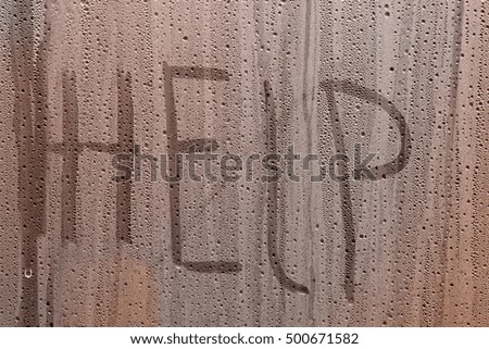 water droplets on glass and various inscriptions