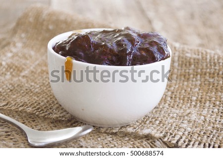 White cup with jam. Food photography.