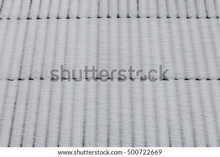 Roof covered snow as background, winter texture, abstract background