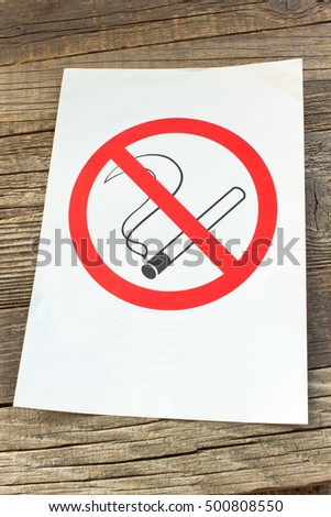 No smoking sign on wooden background