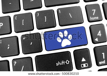 Flat black modern Keyboard of a laptop with Blue Button: white pet dog cat animal paw icon