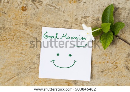 good morning message card greeting and white flowers on background old wood