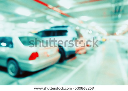 Blur image of car in parking lot.