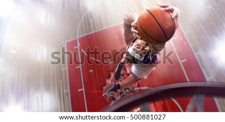 Fat non professional basketball player in action. Fun. Broken basketball court floor