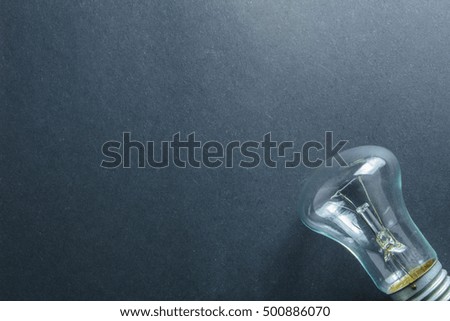 glass electric light bulb on a dark background