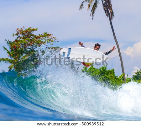 Picture of Surfing a Wave. Bali Island. Indonesia.