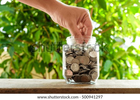 business finance. save money for investment concept money in the glass