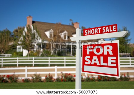 Short Sale Home For Sale Real Estate Sign in Front of New House.