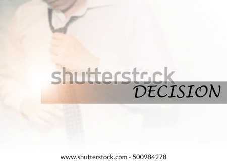 Hand writing DECISION with the young business man on background. Business concept. Stock Photo.