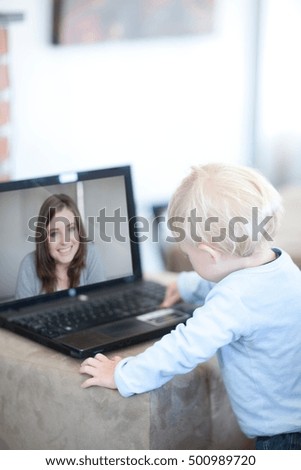 Baby boy distracted on video call to mother