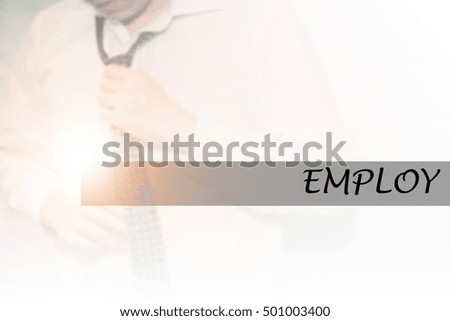 Hand writing EMPLOY with the young business man on background. Business concept. Stock Photo.