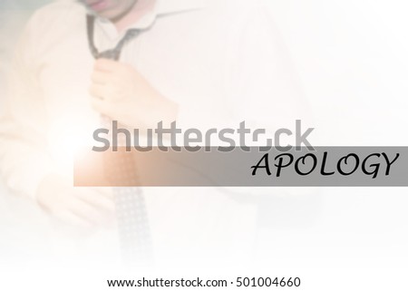 Hand writing APOLOGY with the young business man on background. Business concept. Stock Photo.