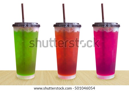 fresh sweet water colourful bright and ice in plastic glass isolated on white background,Summer drinks with ice on white background
