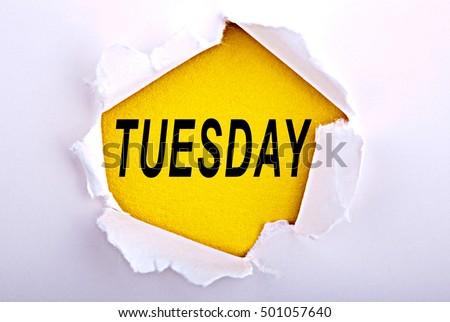 Word Tuesday on ripped paper - Business, technology, internet concept. Stock Photo