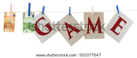 Cardboard sheets with letters GAME and Euro banknotes on a clothesline  isolated on white