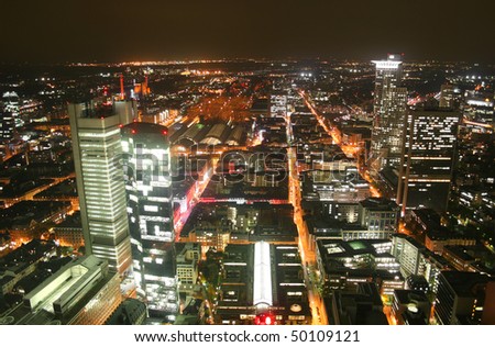 German city Frankfurt with financial district Westend and central station at night