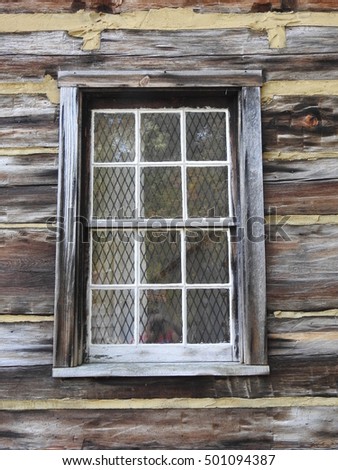 window of a log cabin