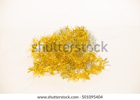 bright shiny gold Christmas decorations closeup on white background