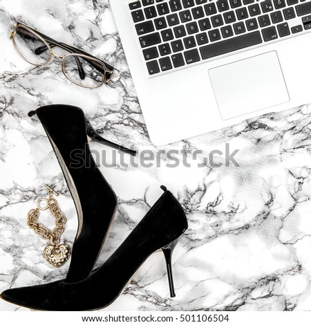 Feminine accessories and notebook on marble table background. Fashion flat lay for blogger social media Instagram style