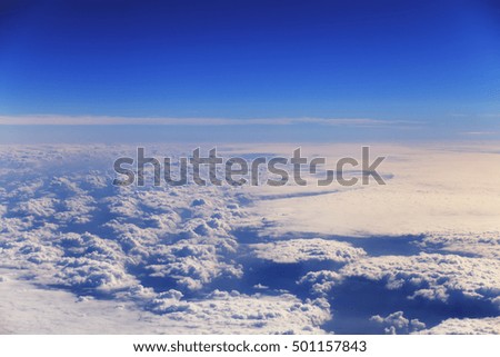 White clouds below blue sky looking like white snow