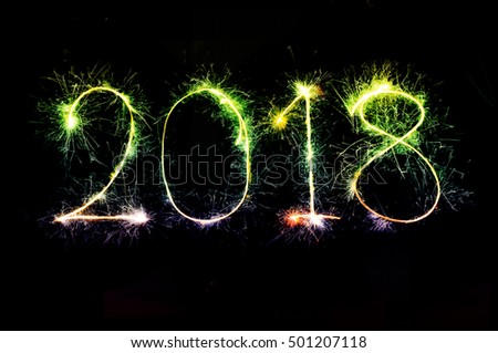 HAPPY NEW YEAR 2018 from colorful sparkle on black background Fireworks light up the sky,New Year celebration fireworks