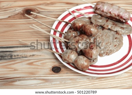 grilled sausage Isaan food Thai, selective focus on wood background