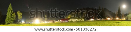 Panoramic photo of camping in Damhurts in Caucasus at night 