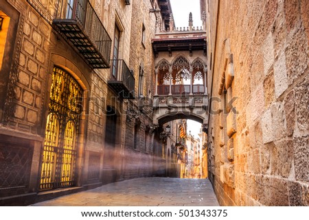 Bridge between buildings in Barri Gotic quarter of Barcelona, Spain Royalty-Free Stock Photo #501343375