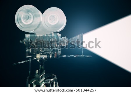 Retro movie camera with projector on abstract city background. Double exposure. Cinema concept