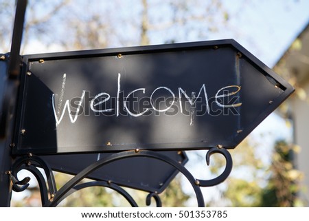 Welcome to visit us. Old iron Sign at home with an invitation to visit.  The external design of hospitality.