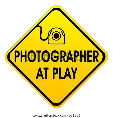 Photographer at play sign.