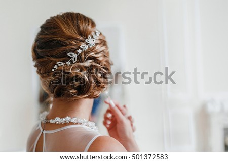 Bridal wedding hairstyle with jewelry wreath Royalty-Free Stock Photo #501372583