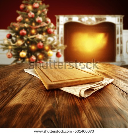 christmas interior of fireplace and xmas tree with free space for your decoration on wooden table place 