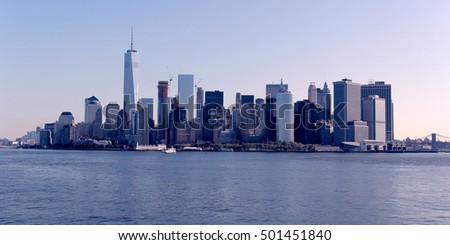 Skyline of New York City, Lower Manhattan. Ellis Island appears in front of the Financial District skyscrapers.
