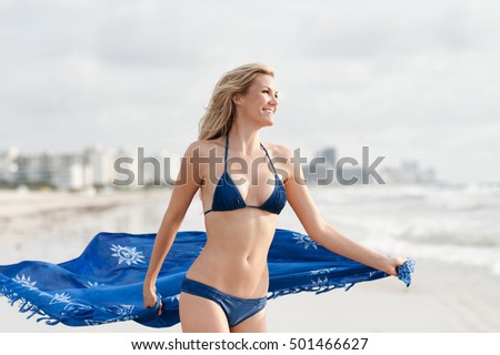 Young Woman with Sarong on Beach