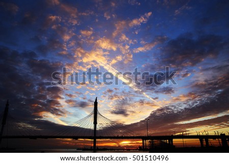 pontoon bridge in St. Petersburg at sunset in autumn