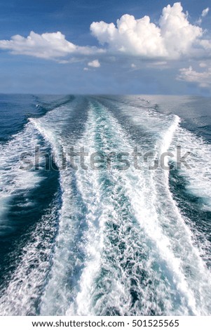 Water blue ocean splash and boat in the sea way background