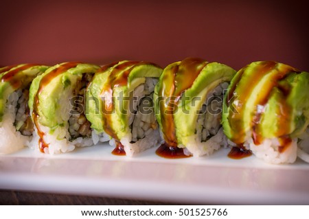 Eel avacado dragon roll with sushi bbq sauce